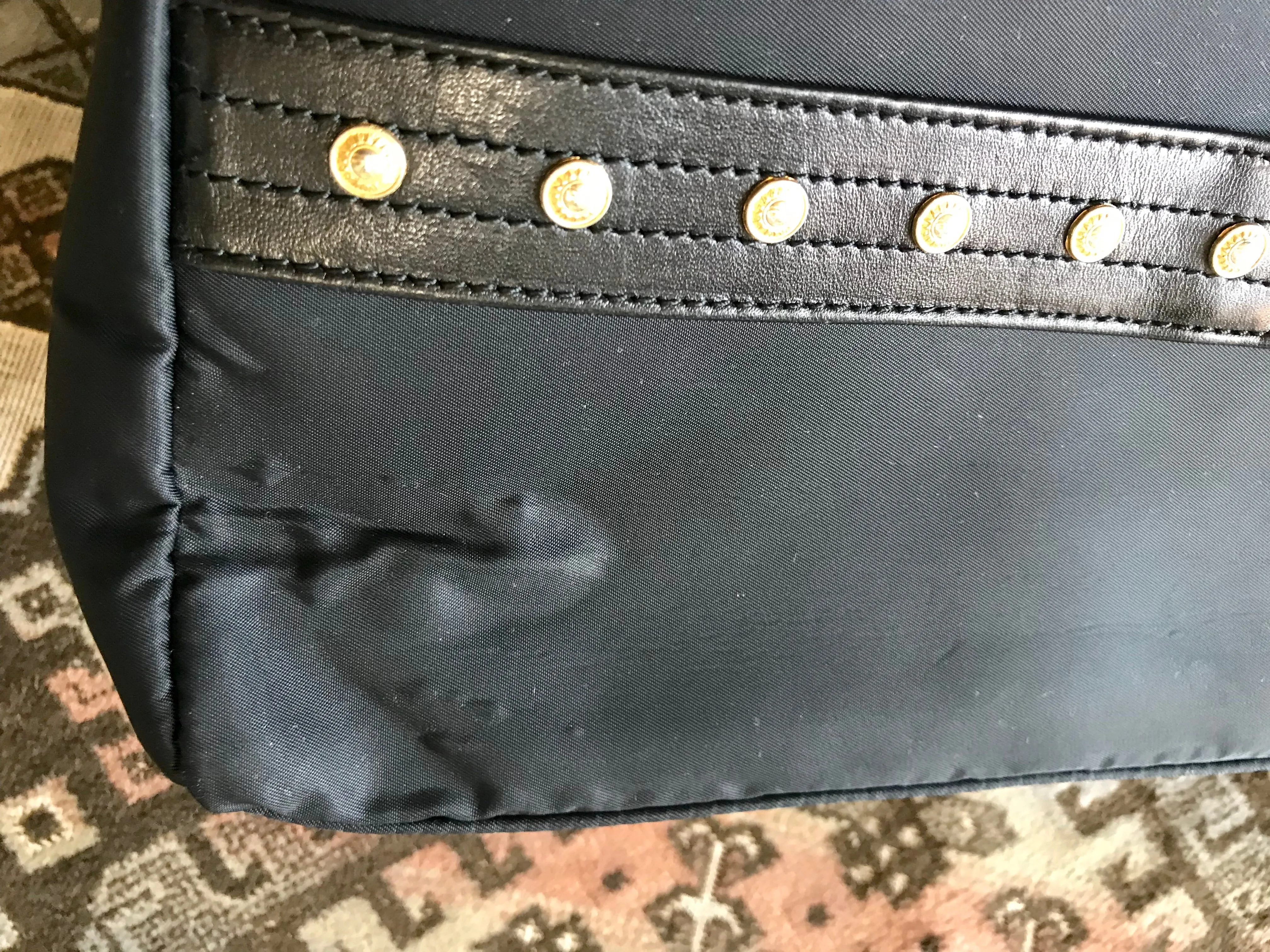 Vintage Gianni Versace large black nylon and leather combination tote bag with gold tone sunburst motifs and chains. 050425r4