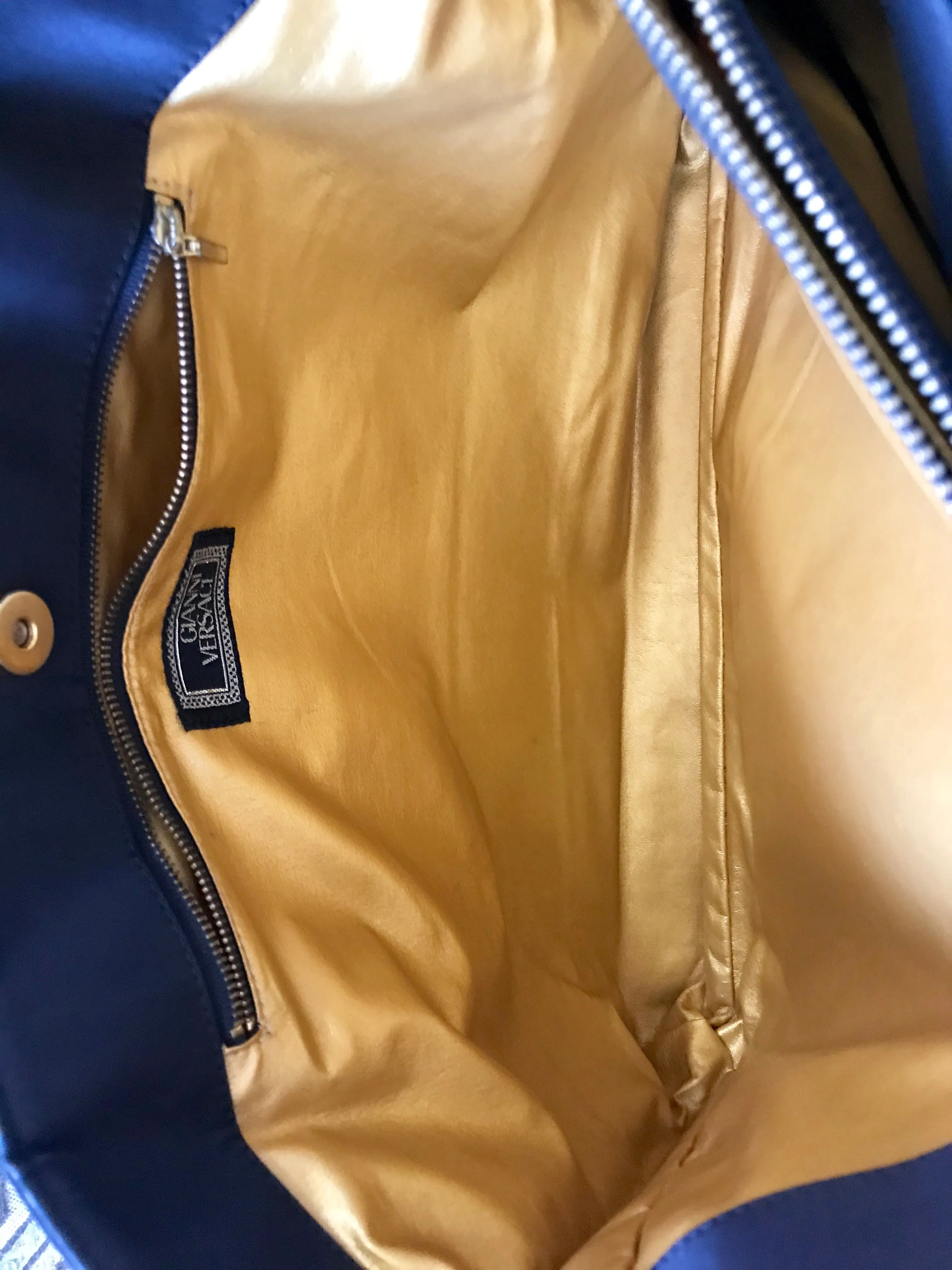 Vintage Gianni Versace large black nylon and leather combination tote bag with gold tone sunburst motifs and chains. 050425r4