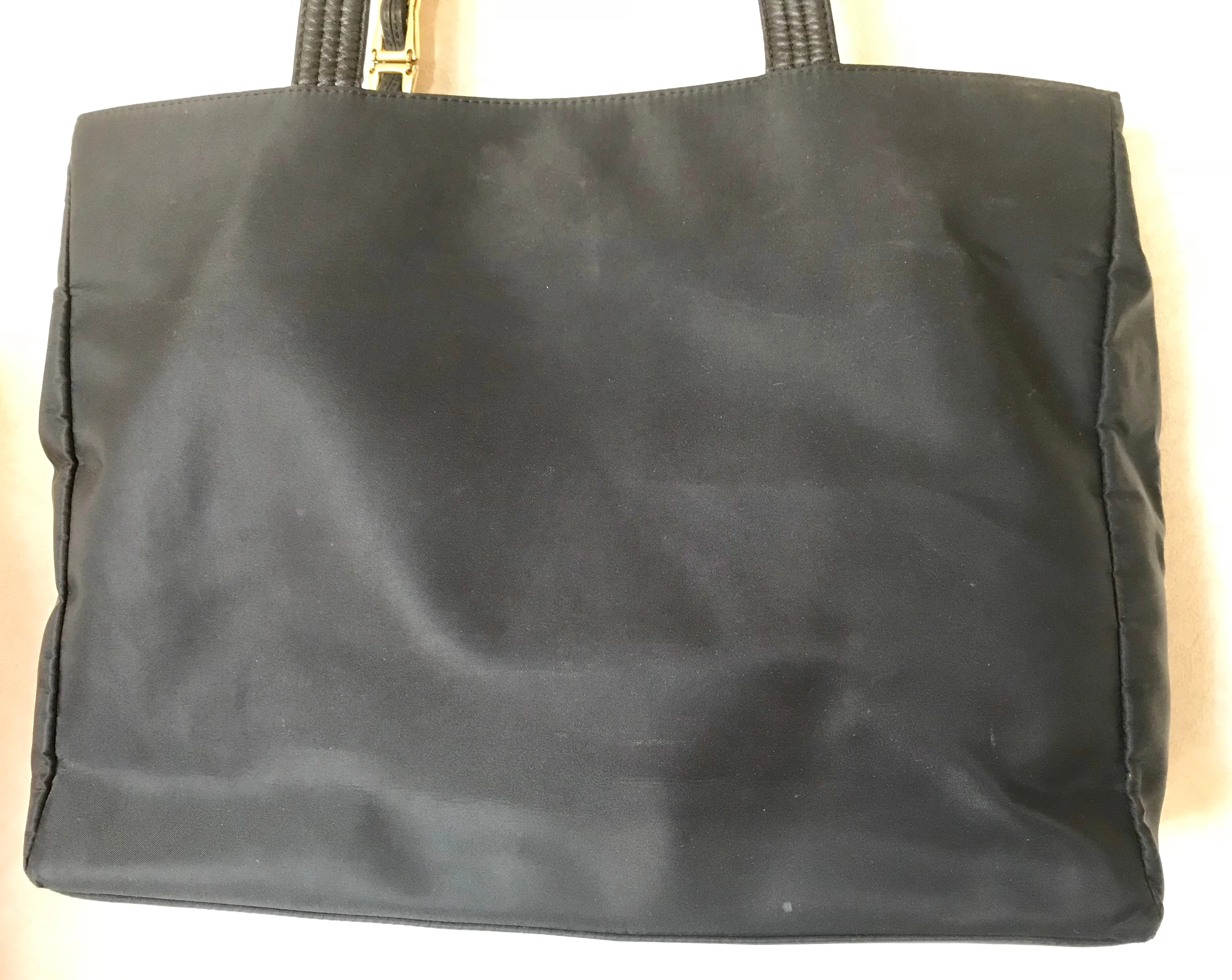 Vintage Gianni Versace large black nylon and leather combination tote bag with gold tone sunburst motifs and chains. 050425r4