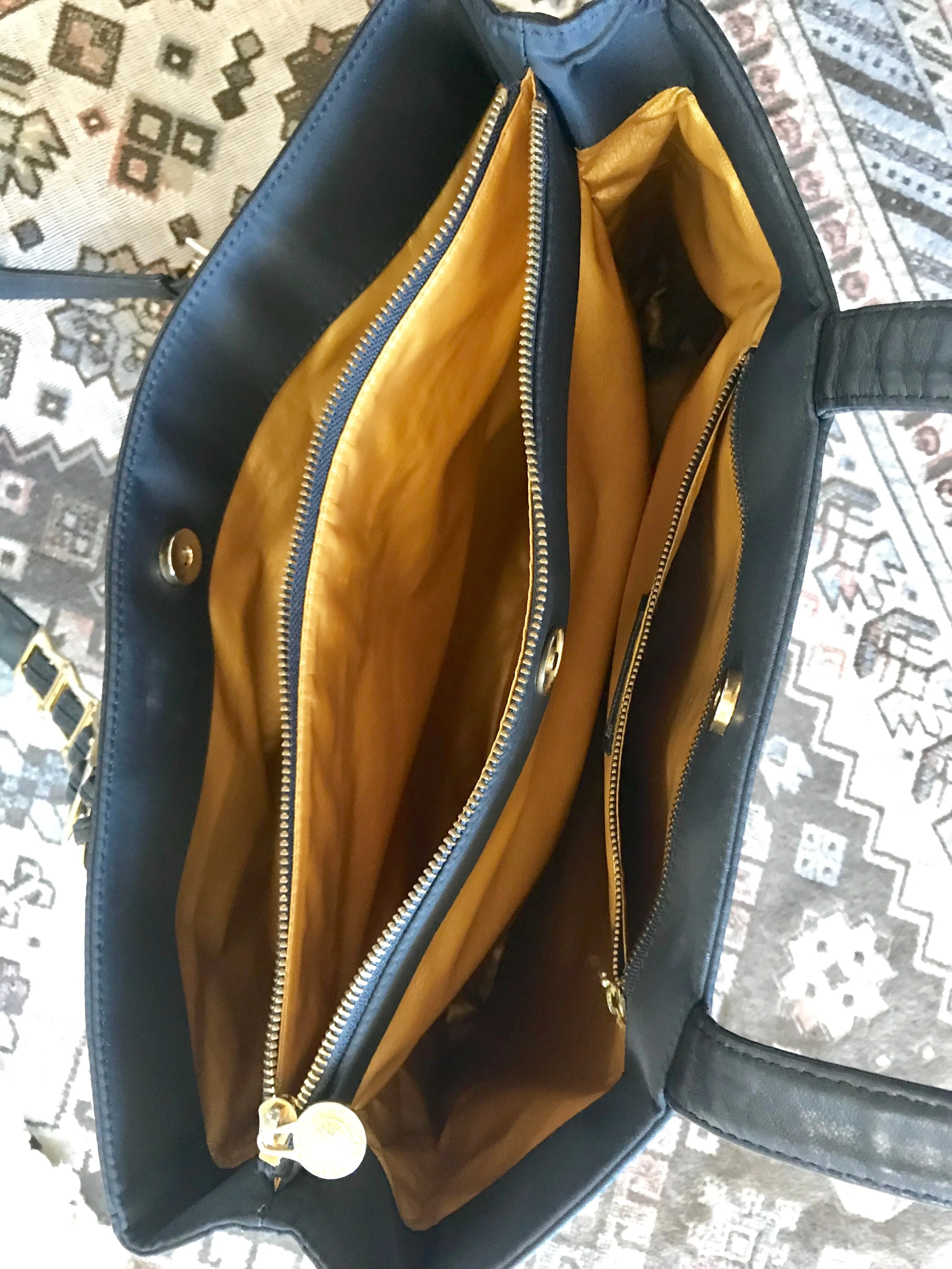 Vintage Gianni Versace large black nylon and leather combination tote bag with gold tone sunburst motifs and chains. 050425r4