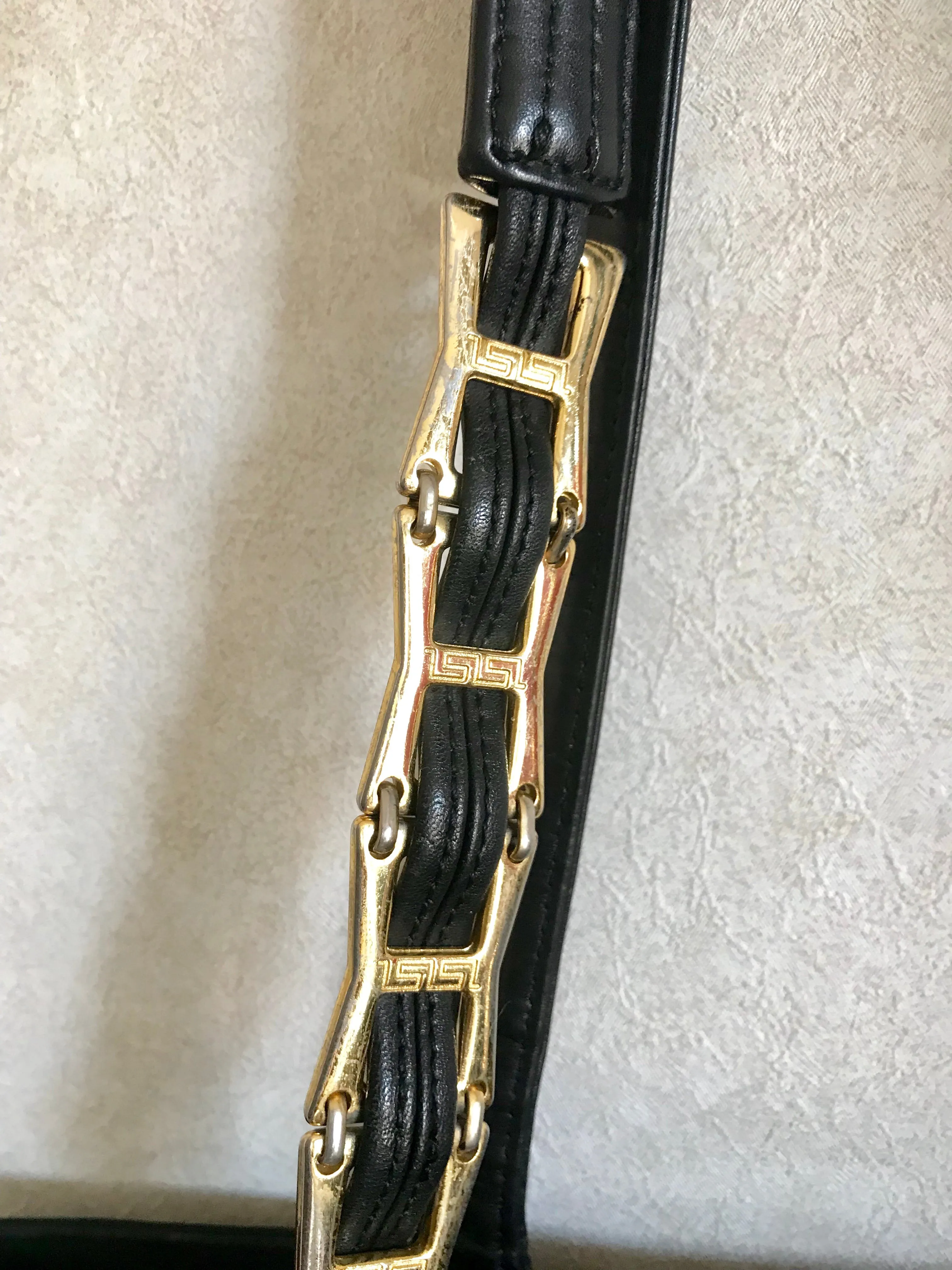 Vintage Gianni Versace large black nylon and leather combination tote bag with gold tone sunburst motifs and chains. 050425r4